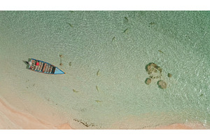 Beautiful aerial view of a boat, a Nature Photo by Goinyk