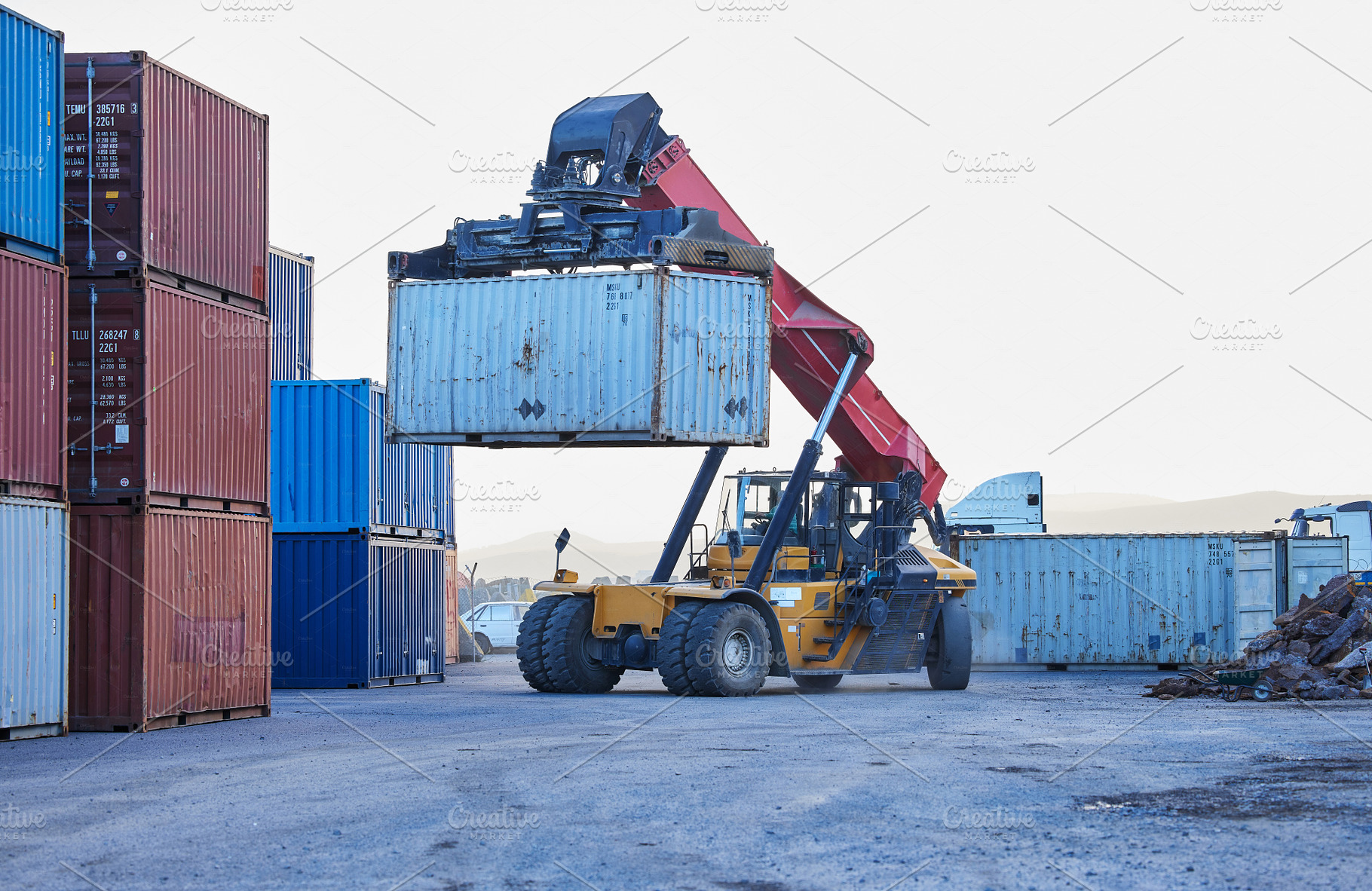Logistics, cargo and forklift with container with stock for delivery in an industrial port. Ecommerce worker working with transportation of manufacturing product with a crane at an outdoor warehouse, a Photo by Peopleimages.com