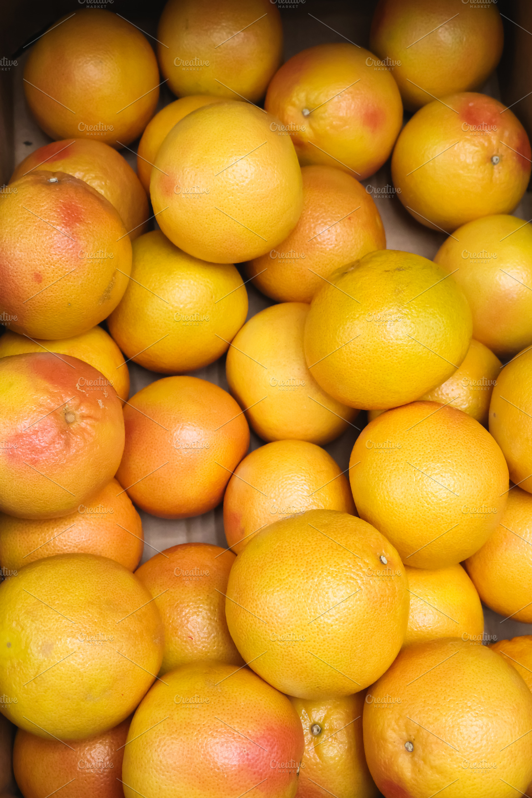 Fresh organic grapefruits offering healthy nutrition, abundant vitamins, and na, a Photo by Studio ANNA