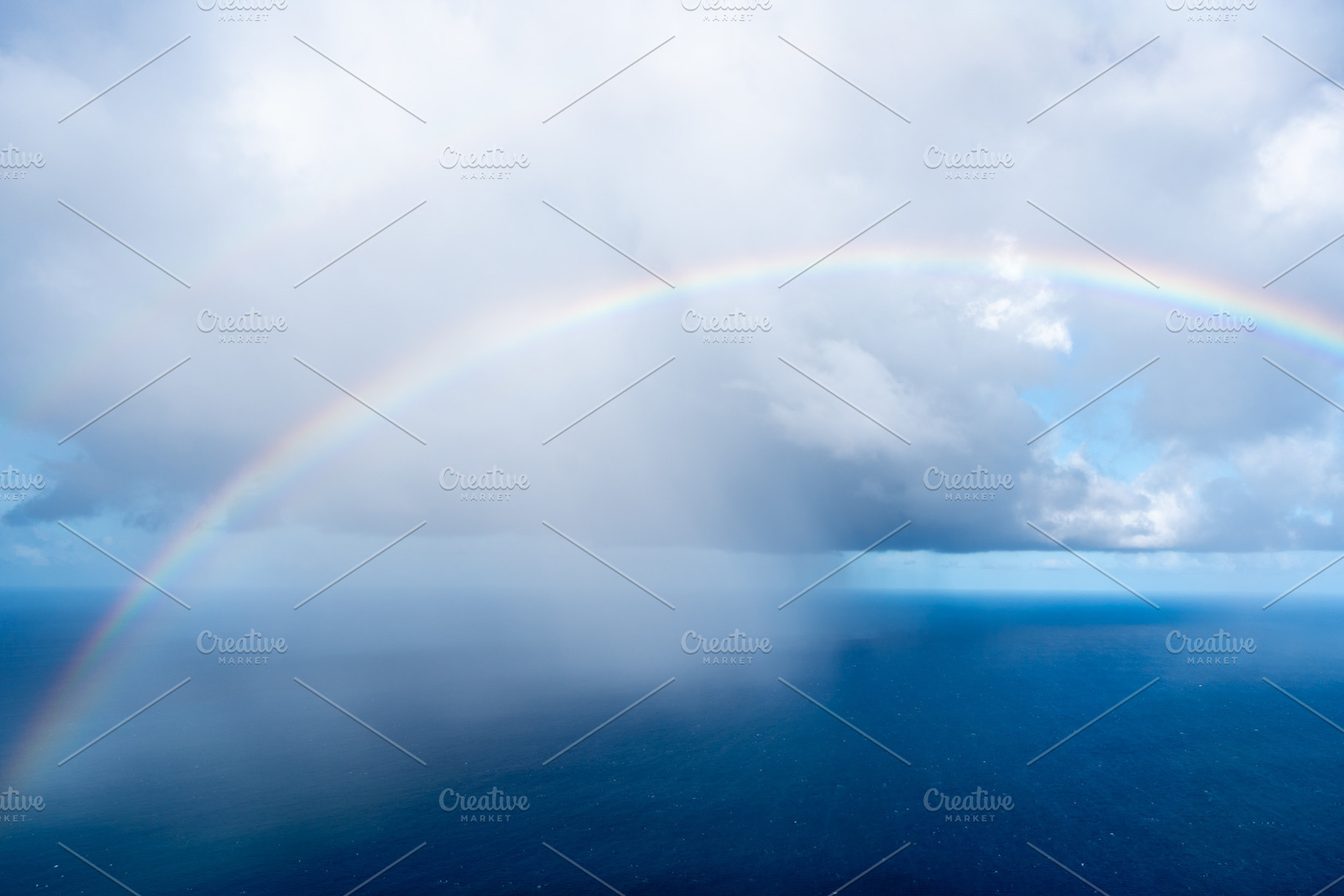 Rainbow over the ocean near Tahaa island, French Polynesia, a Nature Photo by GoodGoods