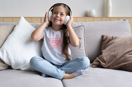 girl in headphones, listening music, a School & Education Photo by OPOLJA