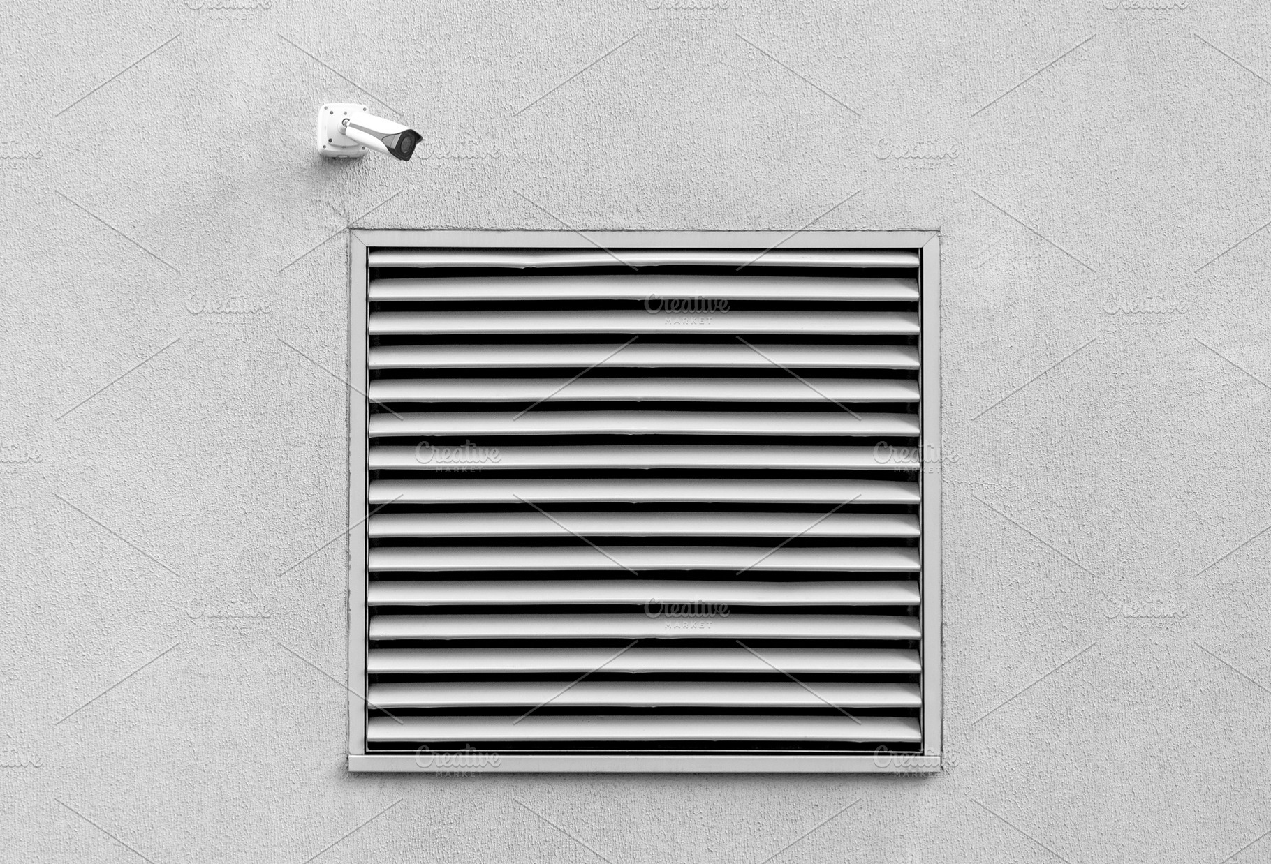Wall with basement window and cctv, an Architecture Photo by BOOCYS