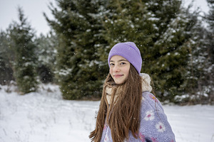 Smiling teenage girl standing, a Person Photo by HalfPoint