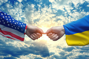 Two hands, one in an American flag and the other in a Ukrainian flag, reach out, an Abstract Photo by AlyaAnd