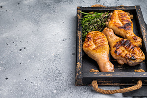Flavorful chicken drumsticks legs, expertly cooked over an open, a Food & Drink Photo by composter-box@mail.ru