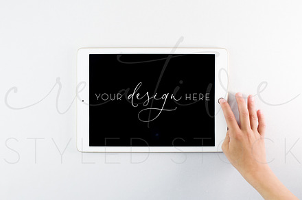 iPad Mockup with Child's Hand