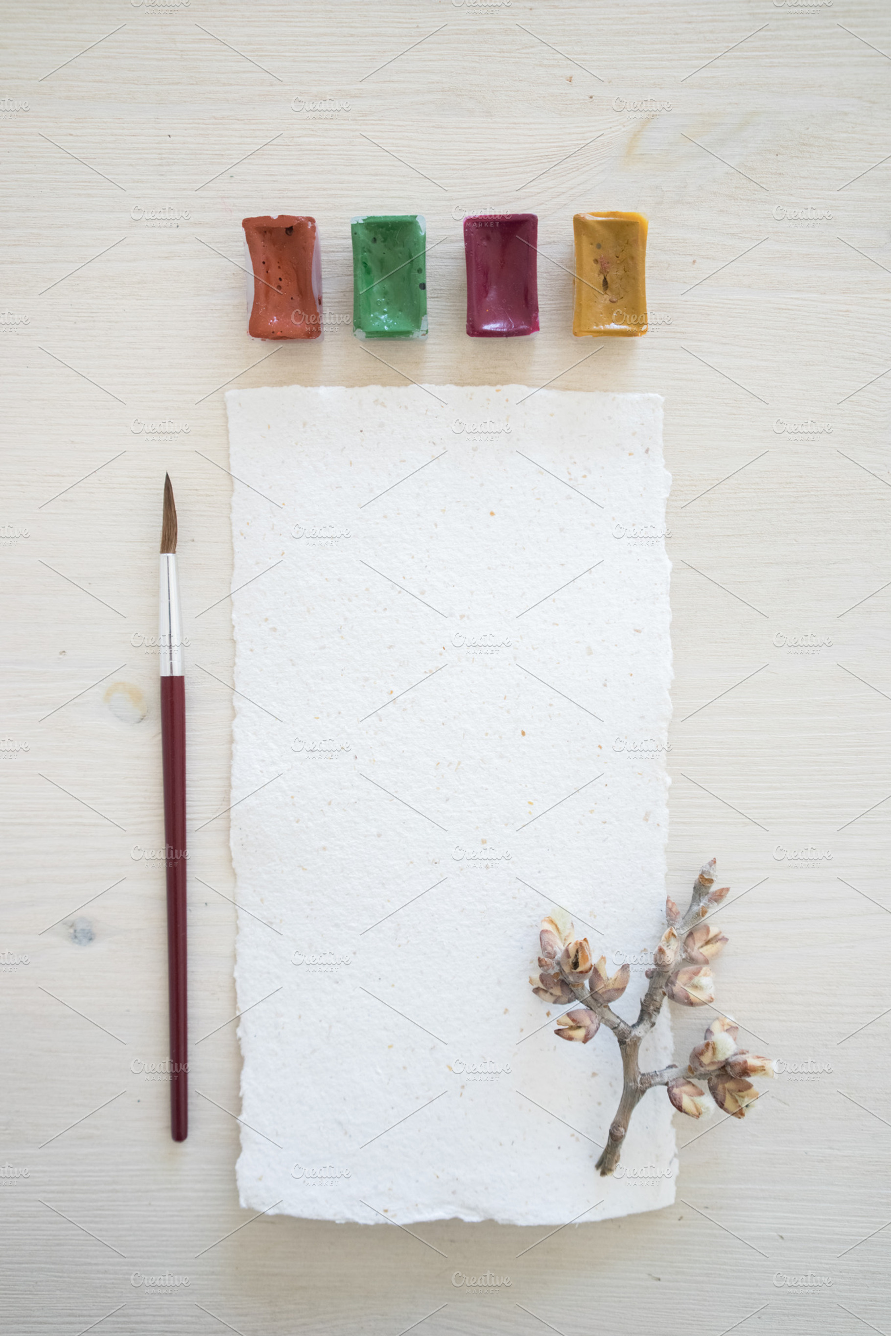 Paper and watercolor pack containing pastel shades, table, and paper, an Arts & Entertainment Photo by Julia Brenner