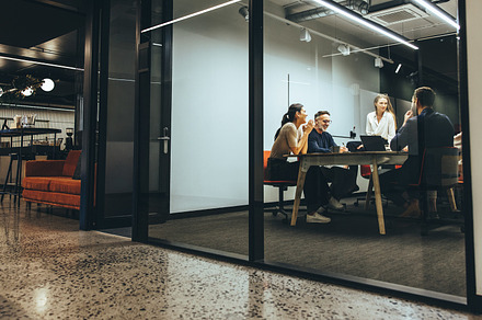 Business colleagues having a meeting in a boardroom, a Person Photo by Jacob Lund