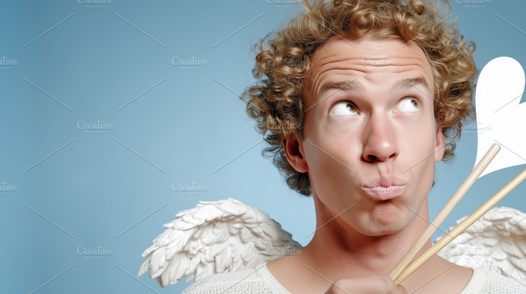 Playful young man dressed as a cupid, a Holiday Photo by MistyDay