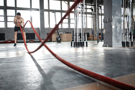 man with battle rope doing exercise, a Sports & Recreation Photo by OPOLJA