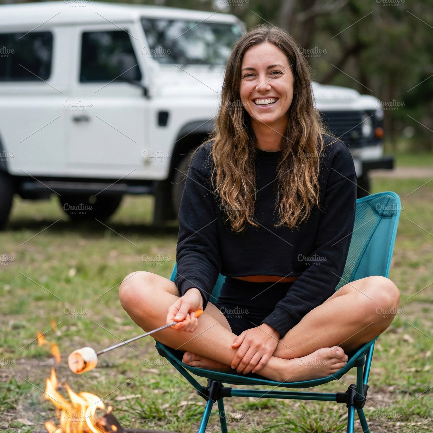 Happy Woman Roasting Marshmallows, a Holiday Photo by Virgo Studio