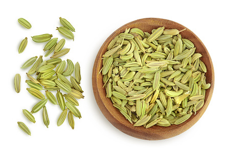 Dried fennel seeds in wooden bowl, a Food & Drink Photo by NataPhoto
