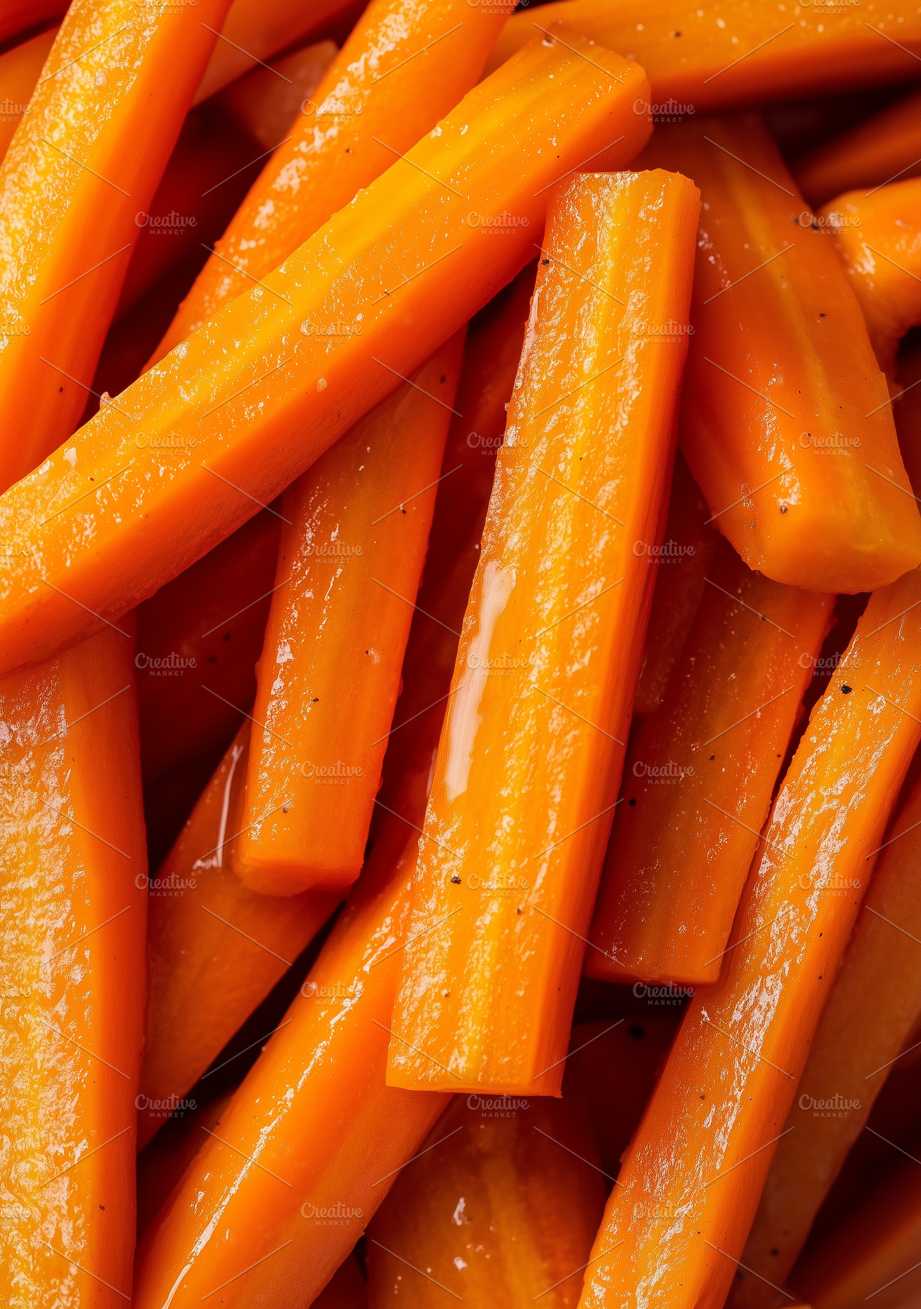 Close up on carrots cut into sticks, a Food & Drink Photo by MistyDay