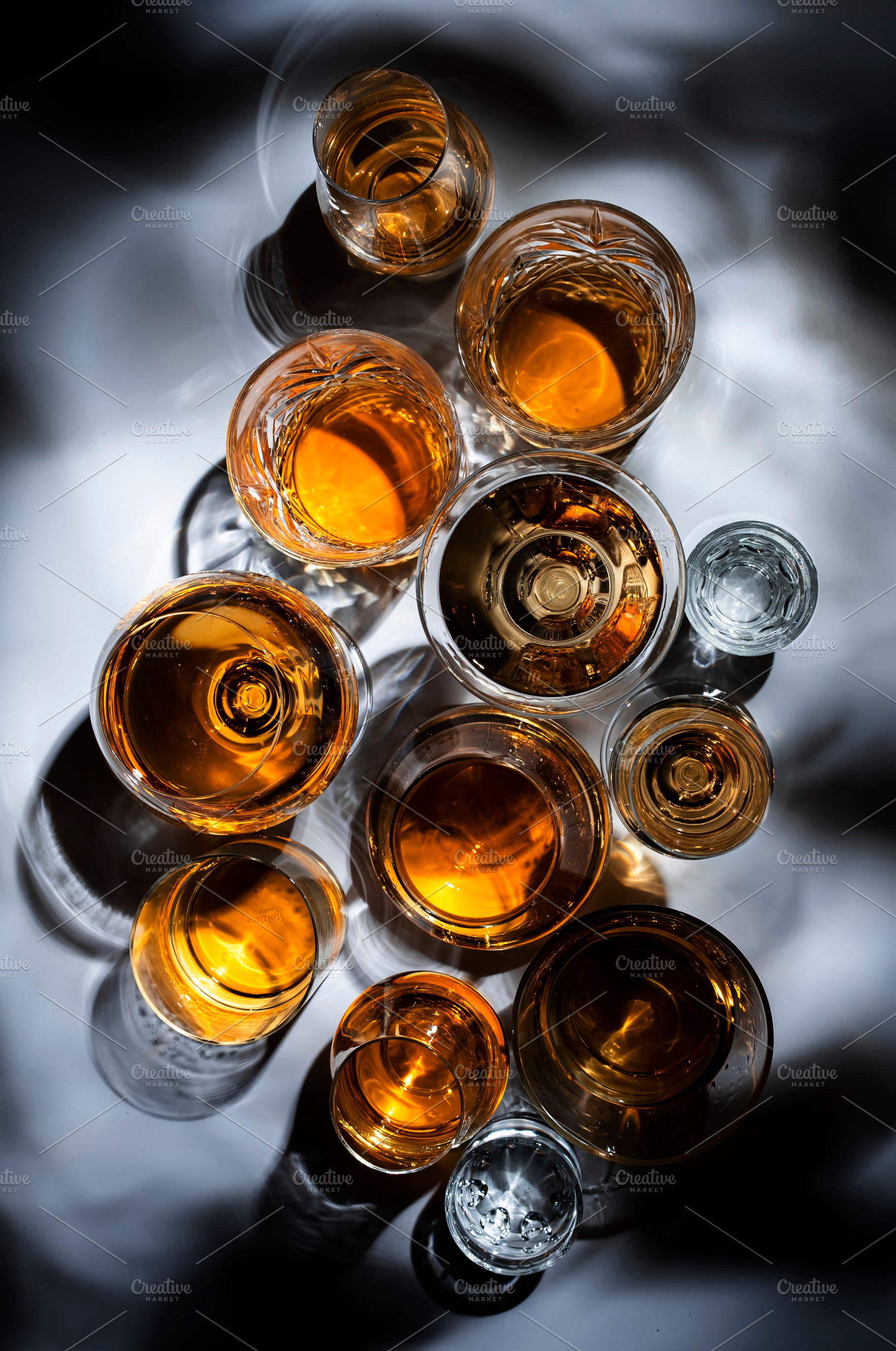 Strong drinks, spirits and distillates in glasses: cognac, grapp, a Food & Drink Photo by 5PH