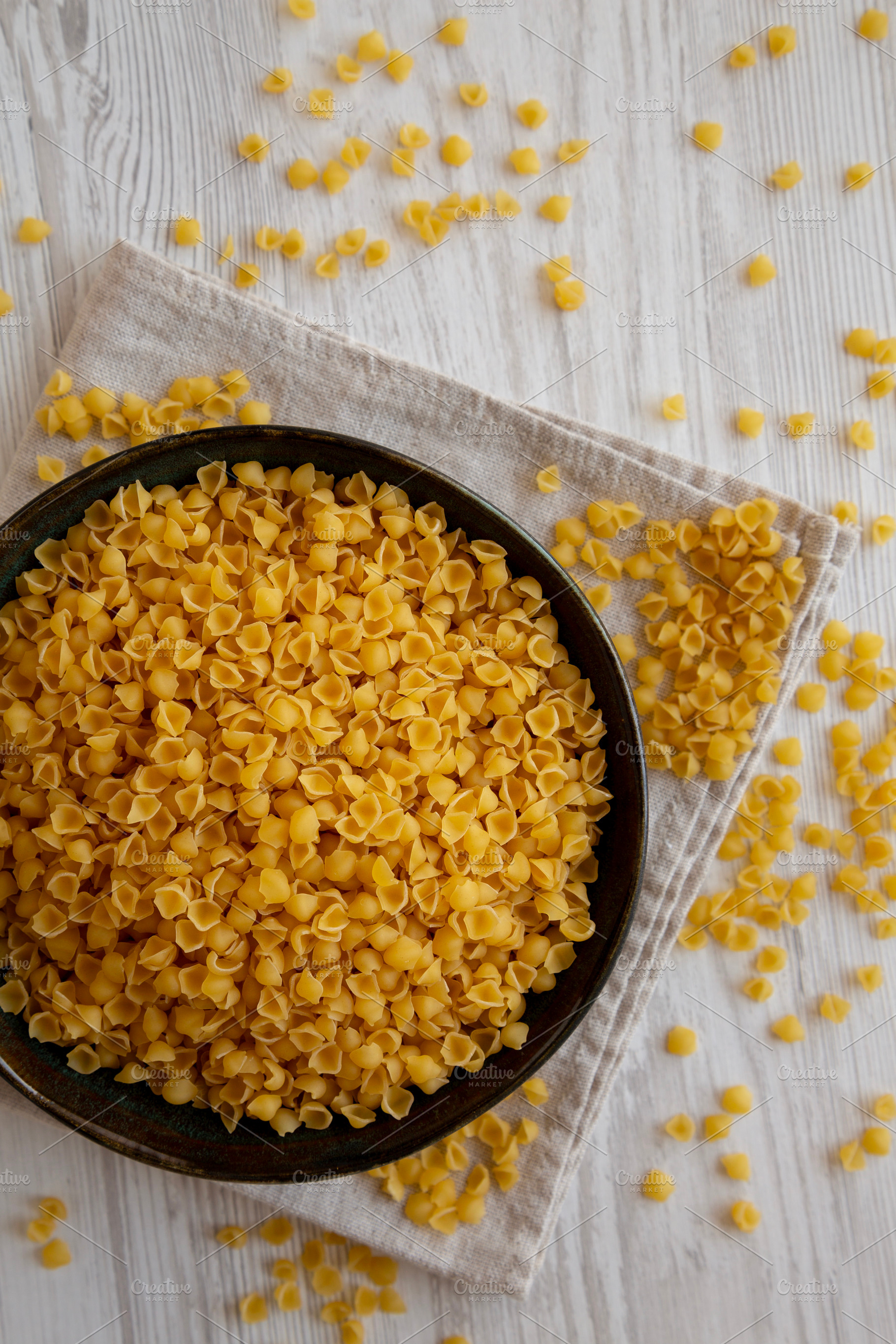 Homemade Perlini Pasta in a Bowl, top view. Flat lay, overhead,, a Food & Drink Photo by LiudmylaChuhunova
