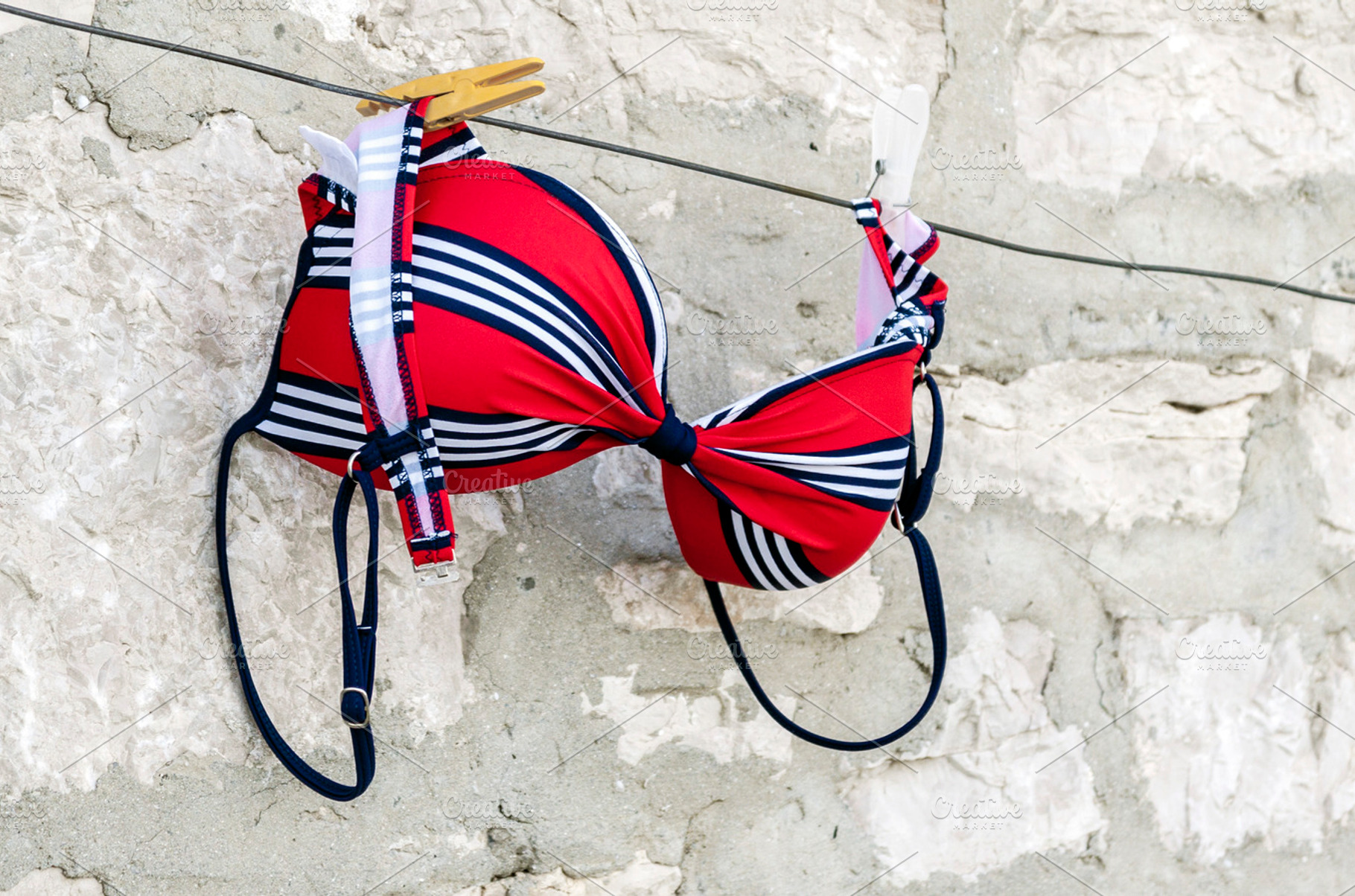 Red swimsuit on clothesline, a Beauty & Fashion Photo by BOOCYS