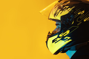 man in a helmet on a yellow background , copy space, a Person Photo by PavelKant