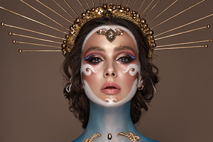 Portrait of a girl with gold and containing beauty, makeup, and fashion