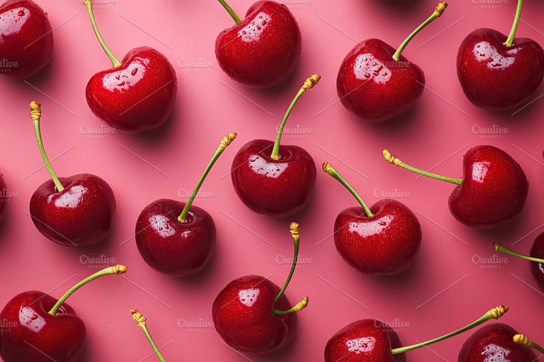 Ripe red cherries arranged on a vibrant pink background for a fresh summer feel, a Food & Drink Photo by AlyaAnd