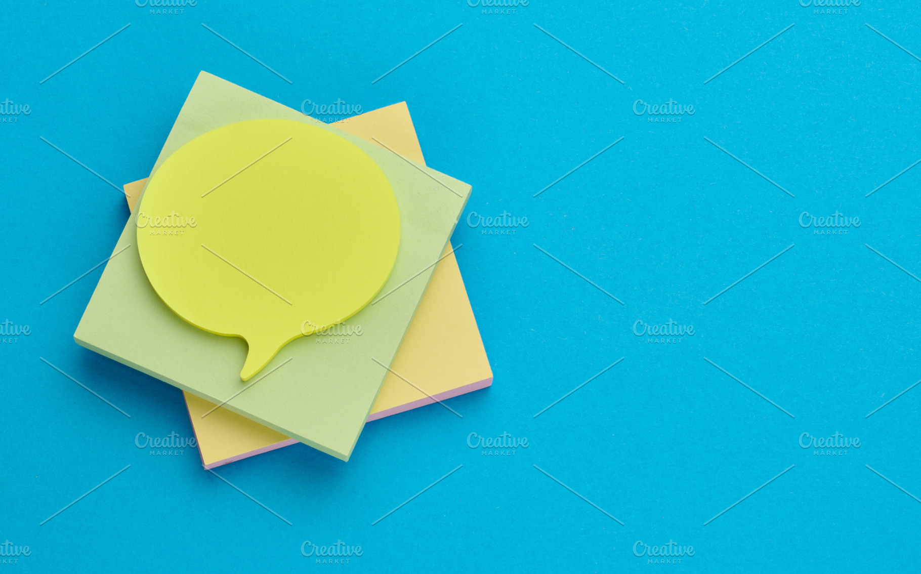 Multicolored thought cloud-shaped sticky notes on a square block, a School & Education Photo by ndanko