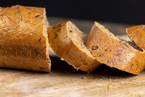 a healthy loaf of soft bread with added seeds and bran, a Photo by rsoollAI