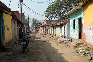 Vibrant Indian village street bustling with daily life in daytime, an Architecture Photo by AlyaAnd