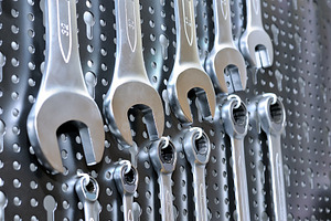 Set of manual wrenches containing wrenches, manual, and workshop