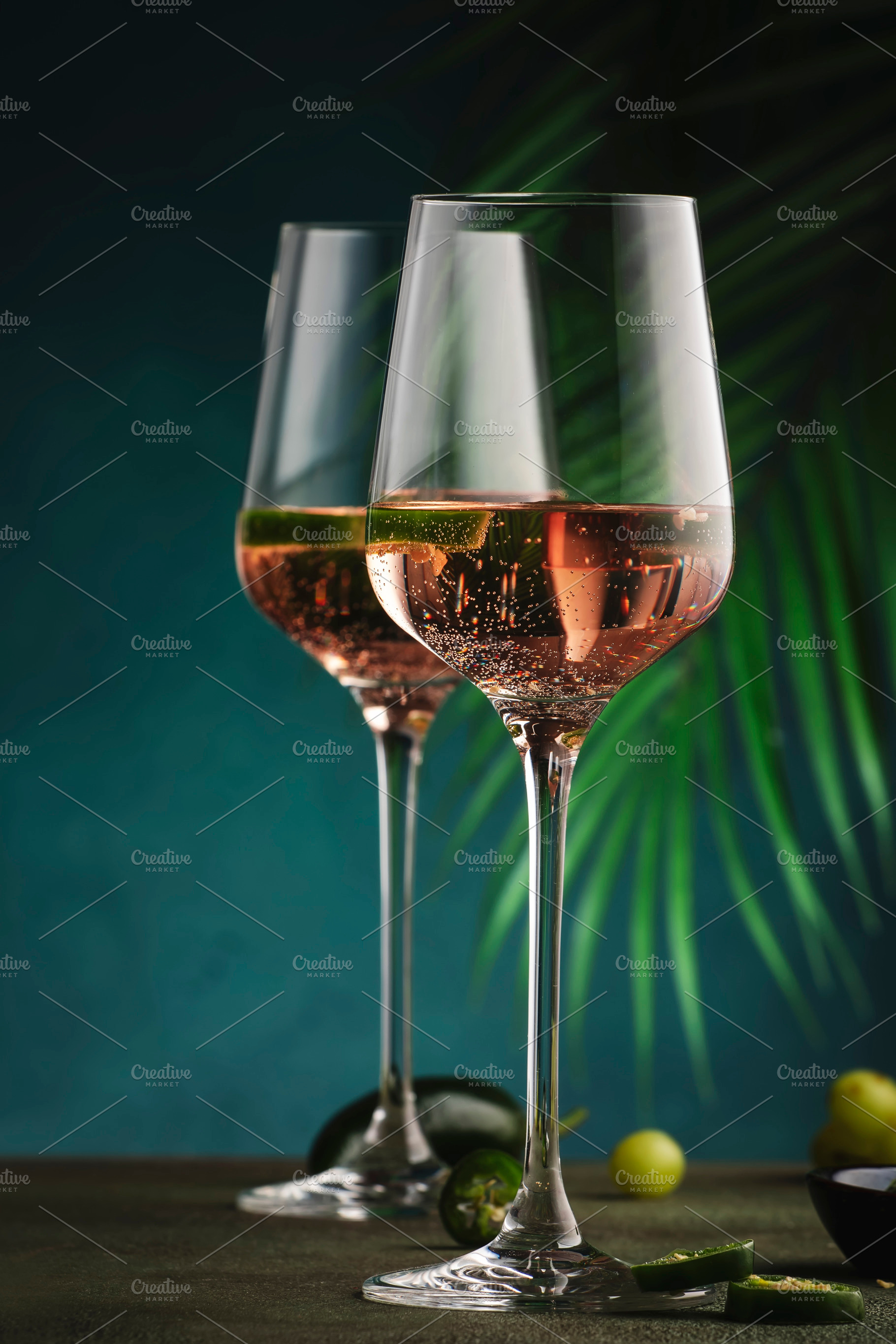 Rose pink wine with jalapeno pepper in wine glass, dark backgrou, a Food & Drink Photo by 5PH