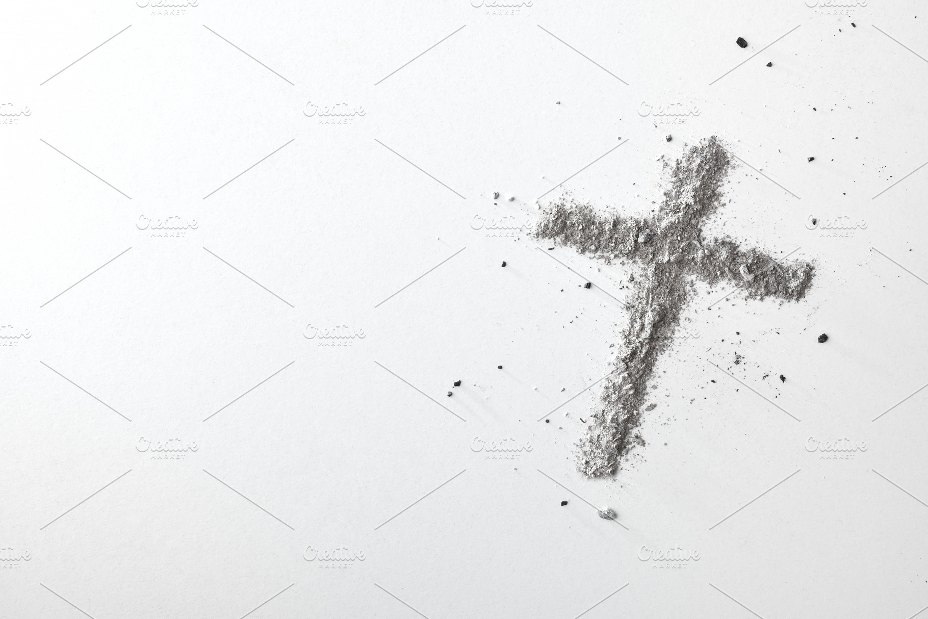 Cross made with ashes on white table top view, a School & Education Photo by Davizro's Market