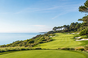 Golf course with lush greenery overlooking ocean, ideal for spor, a Photo by Dvoevnore photos