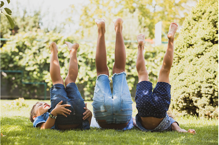 Little friends lie on the grass with, a Person Photo by oksix