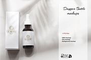 Dropper Bottles Mockup on a white, a Cups & Container Mockup by YuMyart (Thumbnail 1 of 5)