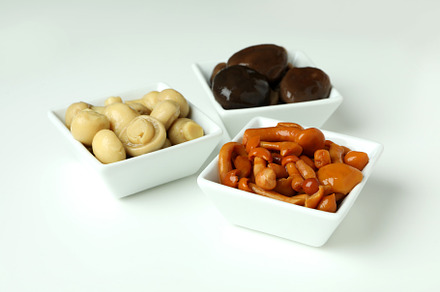 Bowls of marinated mushrooms on white background, a Food & Drink Photo by AtlasStudio PRO