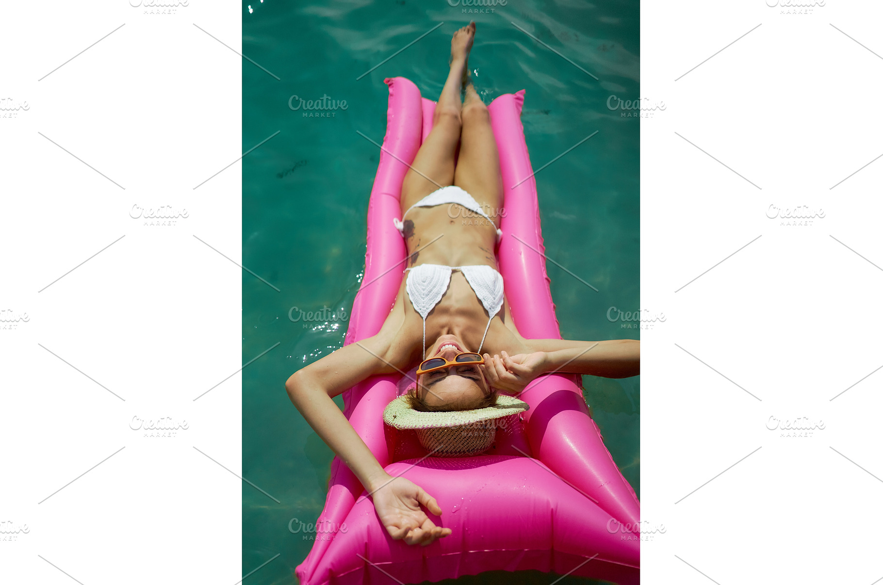 Bikini woman on inflatable pink, a Person Photo by vitaliymateha photography