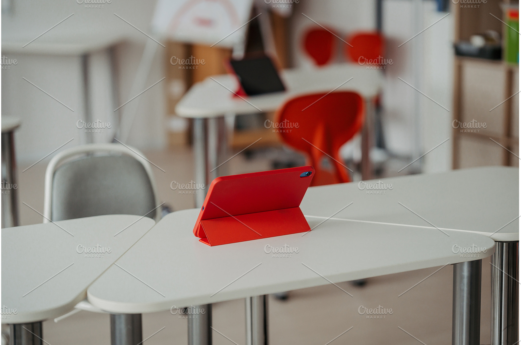 Tablet on a school desk during, a School & Education Photo by HalfPoint