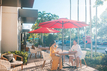 Attractive young couple in love having lunch while sitting in outdoor cafe at s, a Person Photo by travnikovstudio