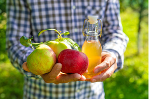 Apple cider vinegar against a, a Food & Drink Photo by yanadjana