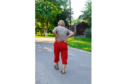 grandmother hurts her back on the, a Person Photo by yanadjana