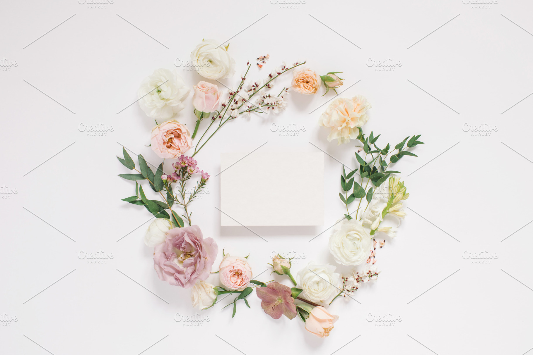 Elegant floral composition with card, an Arts & Entertainment Photo by Nina Stock Photos