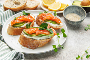 Bruschetta with salmon, avocado, and cream cheese, a Food & Drink Photo by Olena Rudo