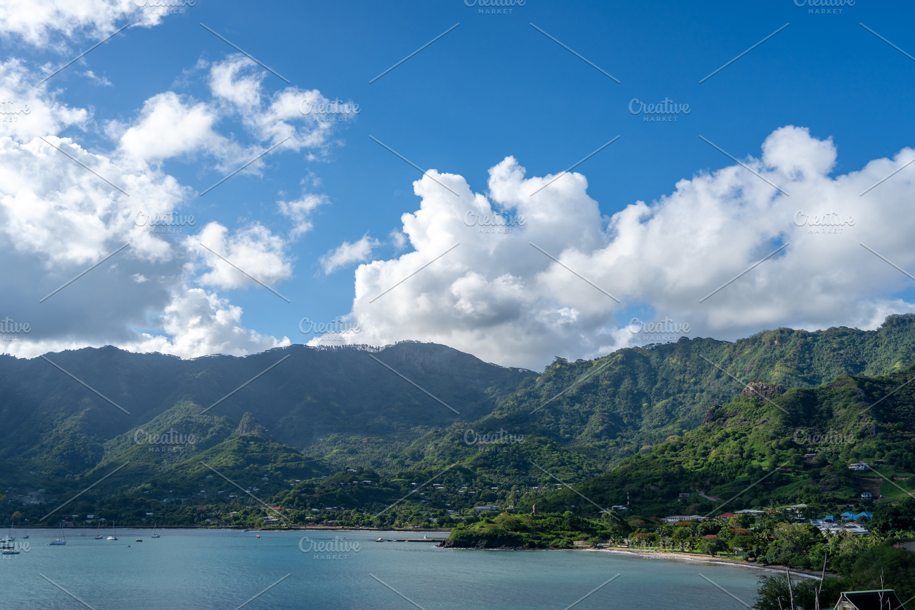 Taiohae Bay and town with anchored sailboats in Nuku Hiva, Marqu, a Photo by GoodGoods
