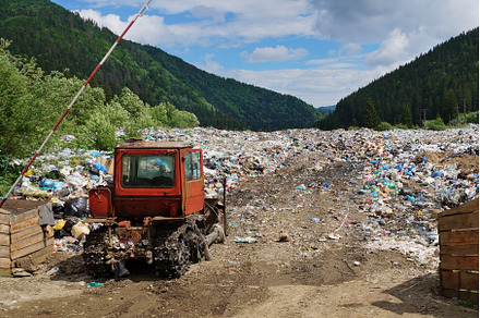 Old bulldozer at landfill entrance, an Industrial Photo by Oleksandr Berezko