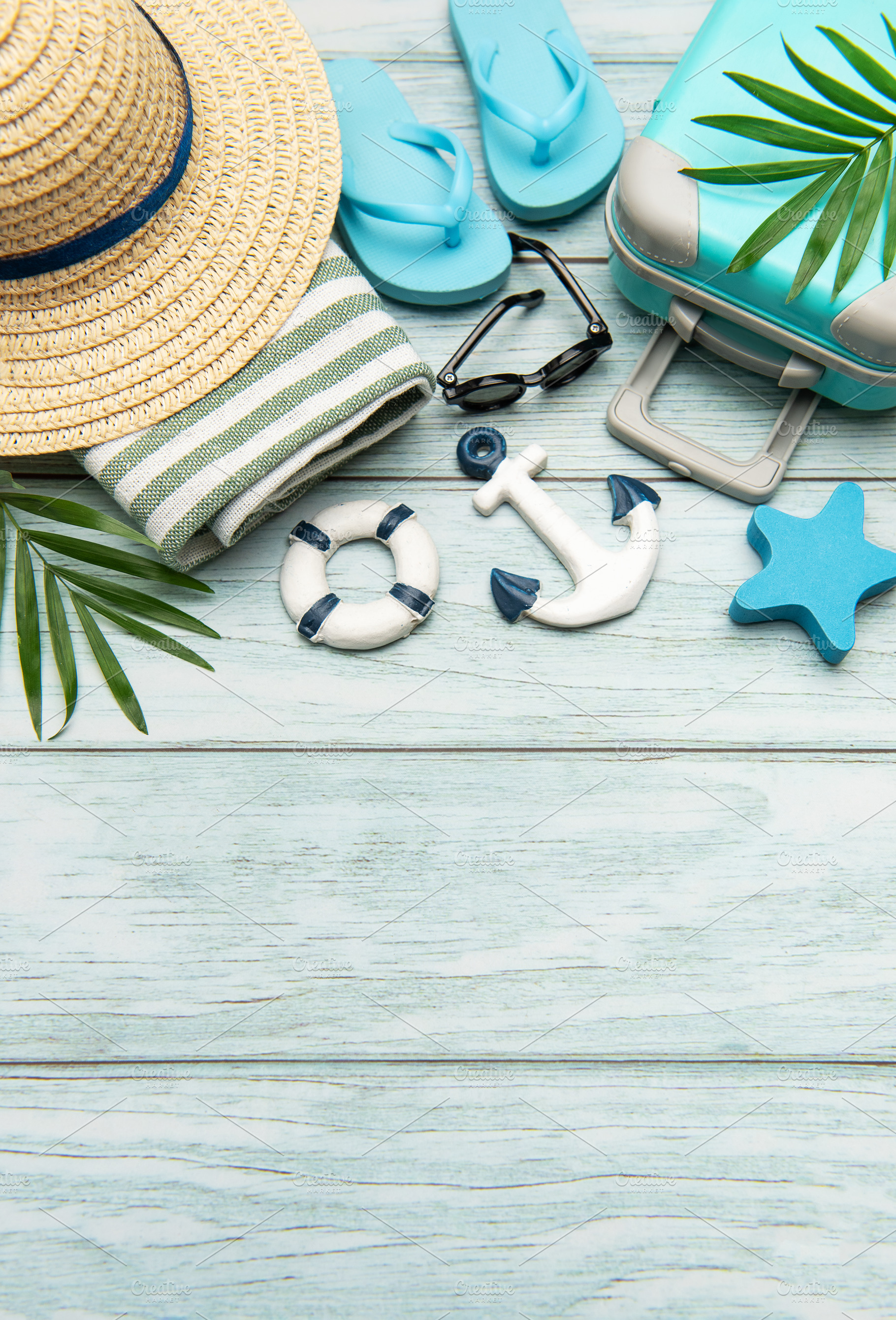 Summer vacation accessories lying on wooden background with copy, a Holiday Photo by Olena Rudo