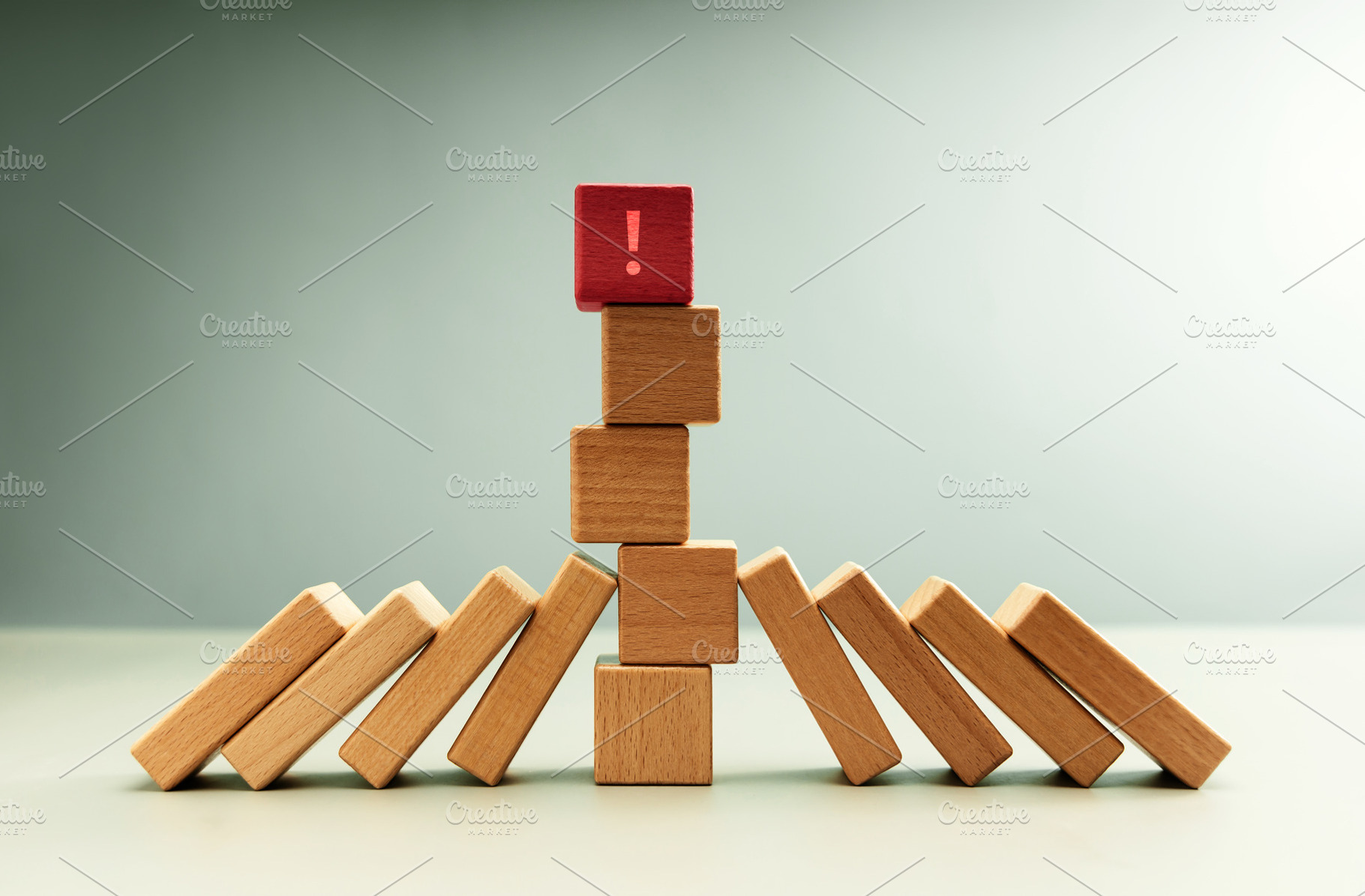 Red wooden block with exclamation mark standing among dominoes, a Photo by salmon.black