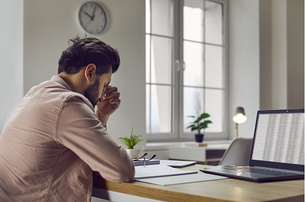 Tired, stressed man with a headache, a Business Photo by StudioRomantic