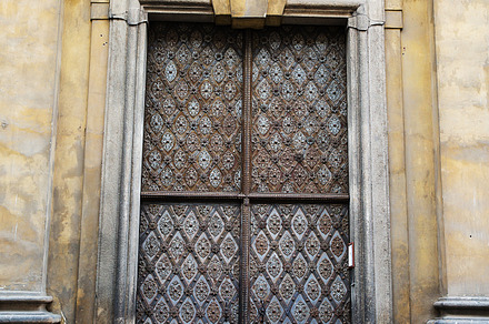 Ancient wrought iron gates and doors .