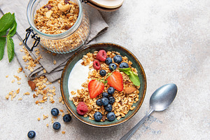 Healthy breakfast granola bowl with fresh berries, a Food & Drink Photo by Olena Rudo