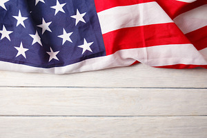 American flag close up on wood desk