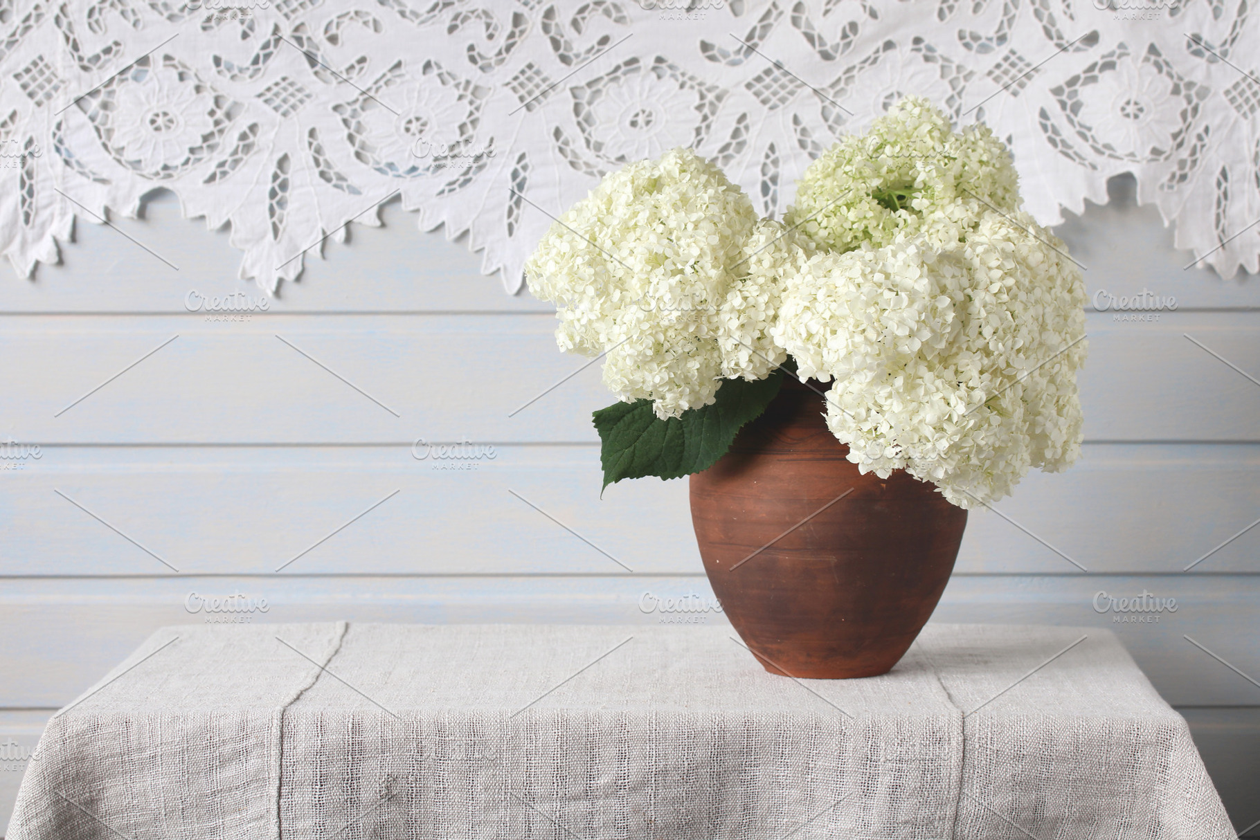 a bouquet of white hydrangea, a Photo by BalaguR
