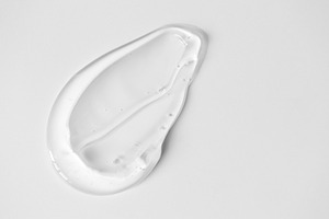 Close-up aloe gel smear on white